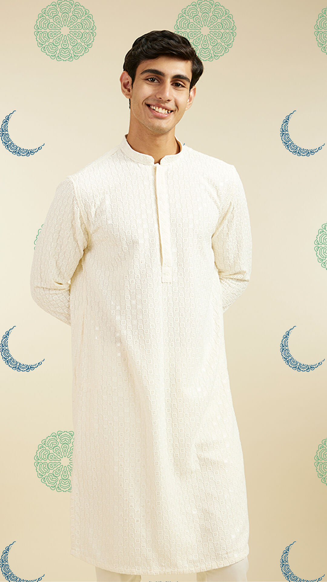 Man wearing a classic off-white embroidered kurta, a perfect elegant Eid outfit choice.